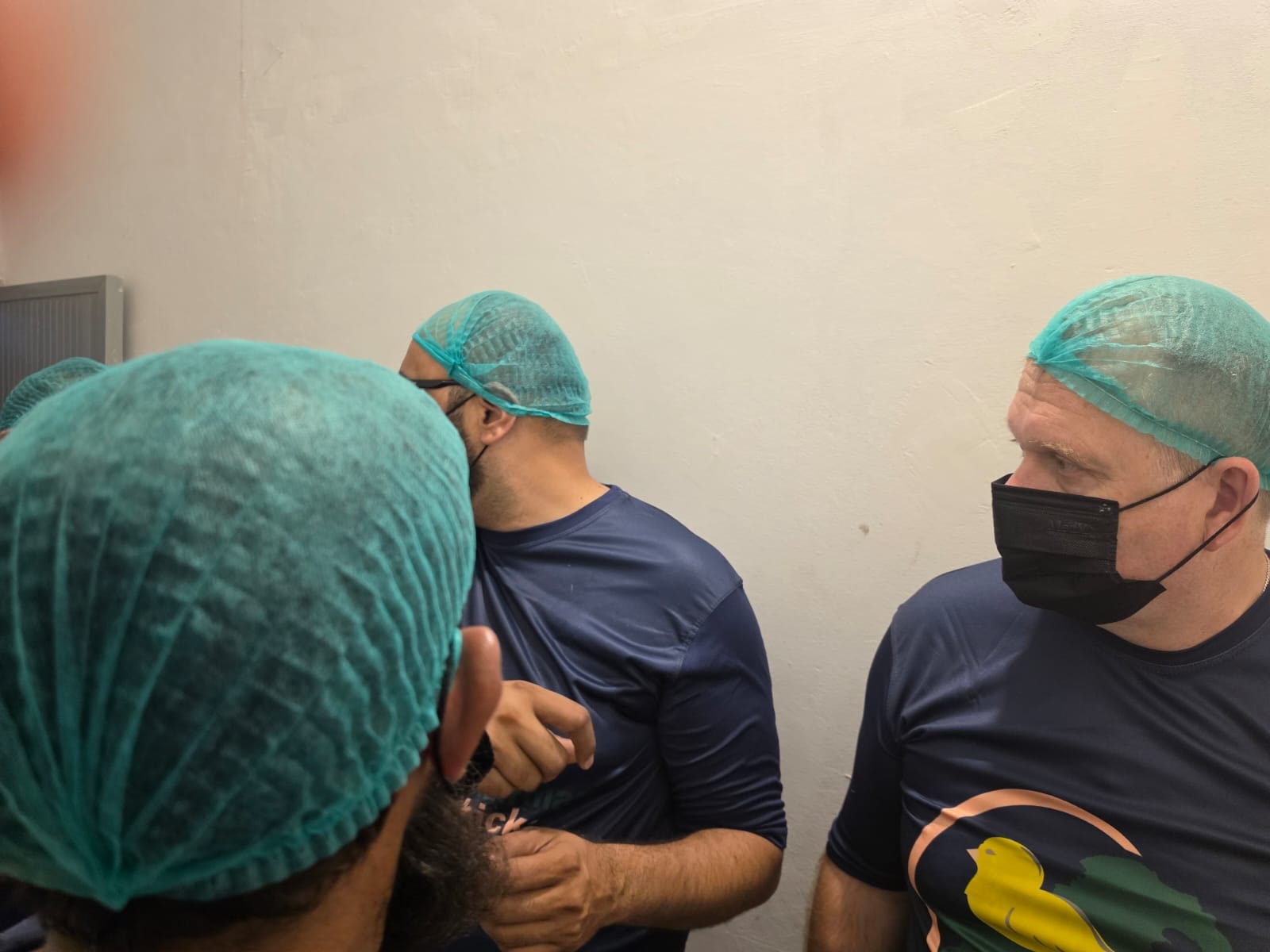 Dr. Mikhail Malyshev and team reviewing hatchery operations inside the facility